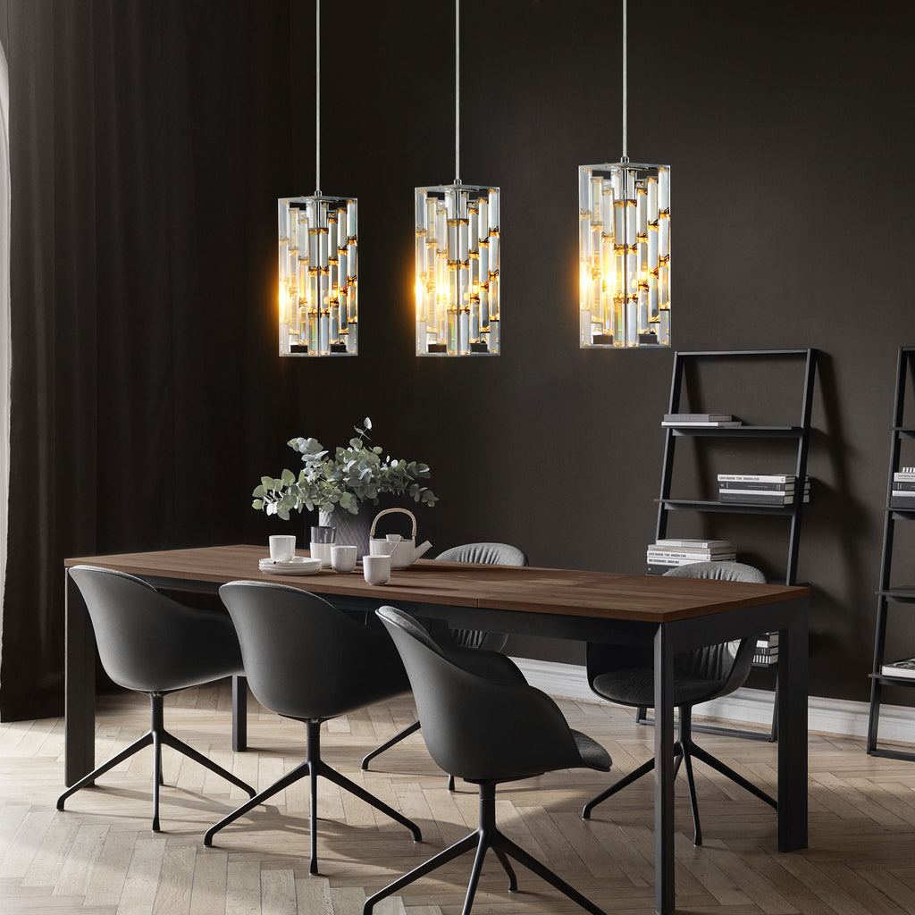 Modern dining room with wooden table, black chairs, and three pendant lights.