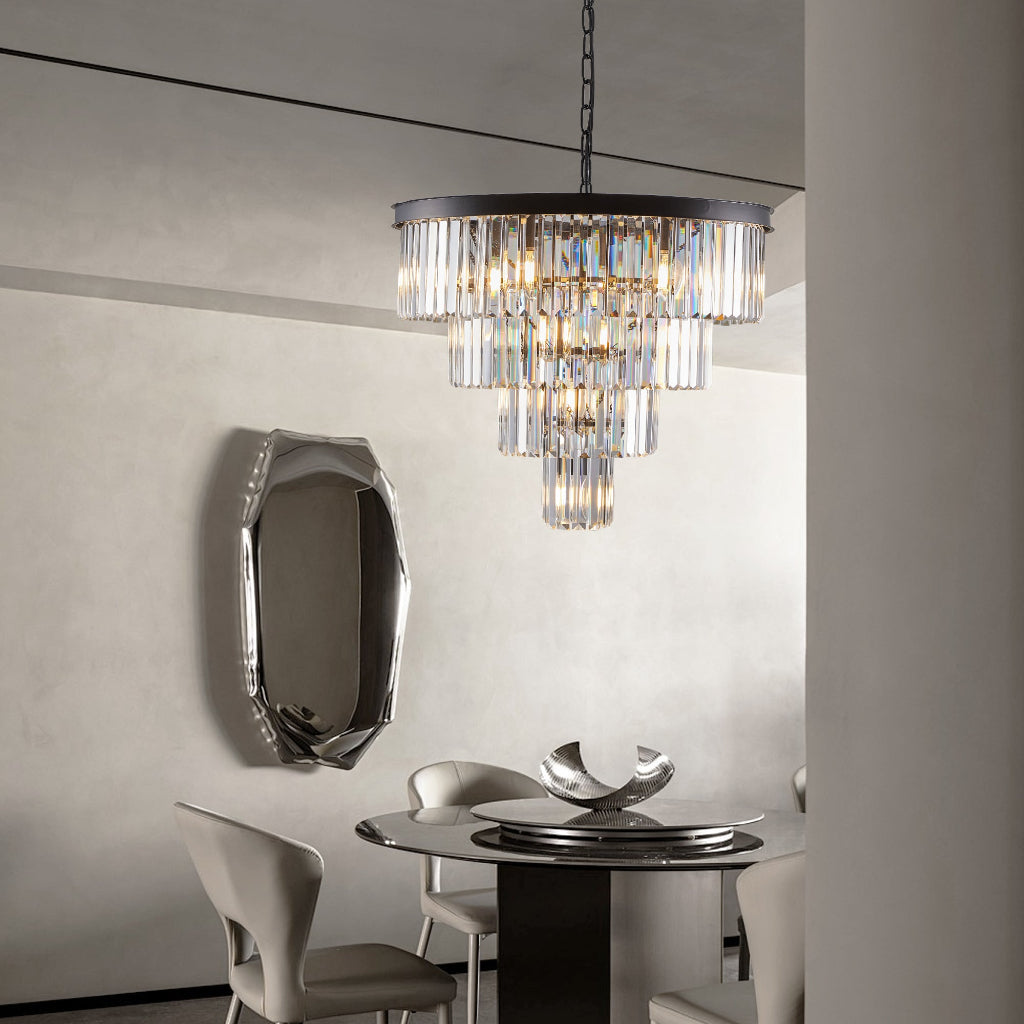 Modern chandelier hanging above a dining table with chairs in a stylish room.