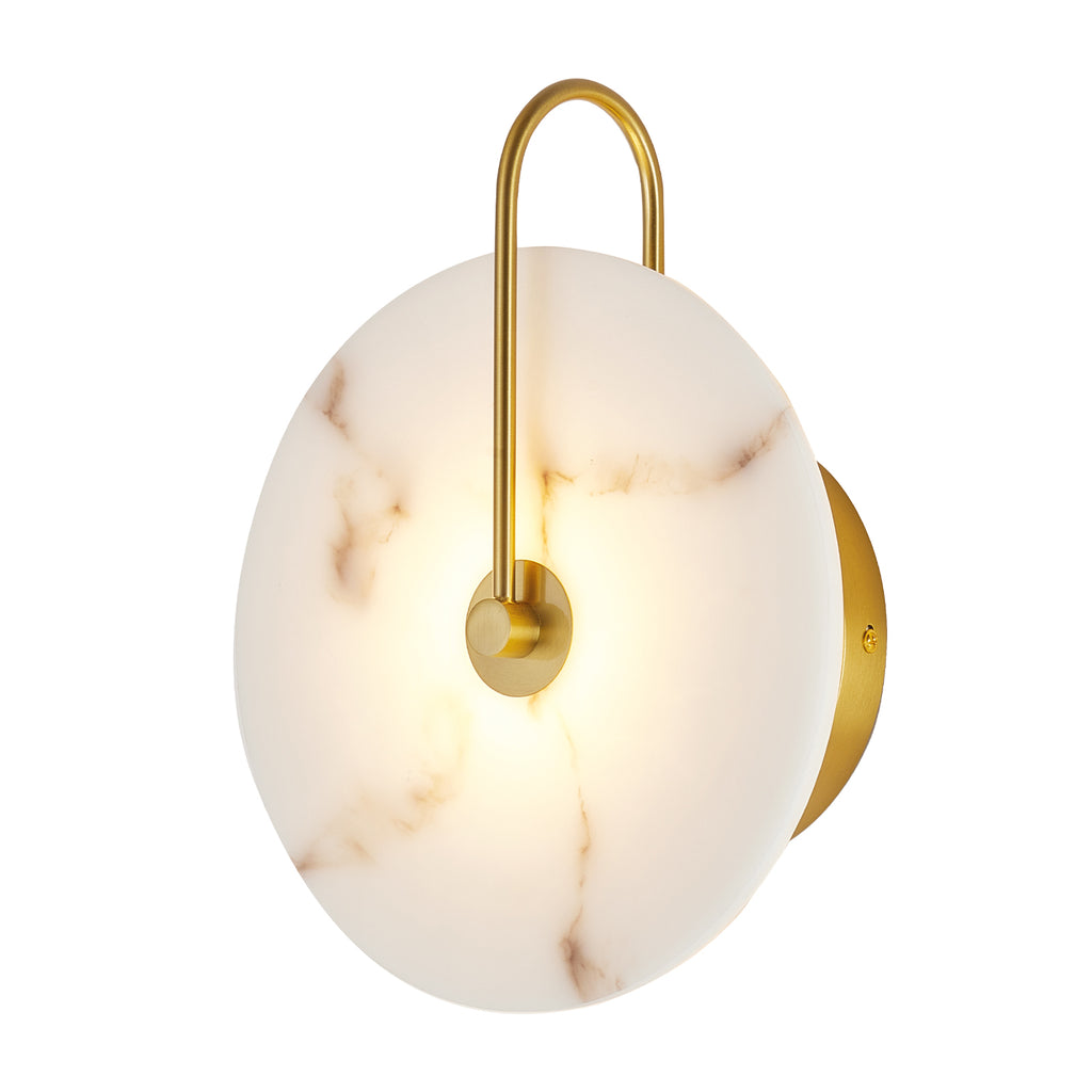 A modern wall sconce with a round white marble-look glass shade, a curved gold metal arm, and a circular gold wall mount, shown against a plain white background.