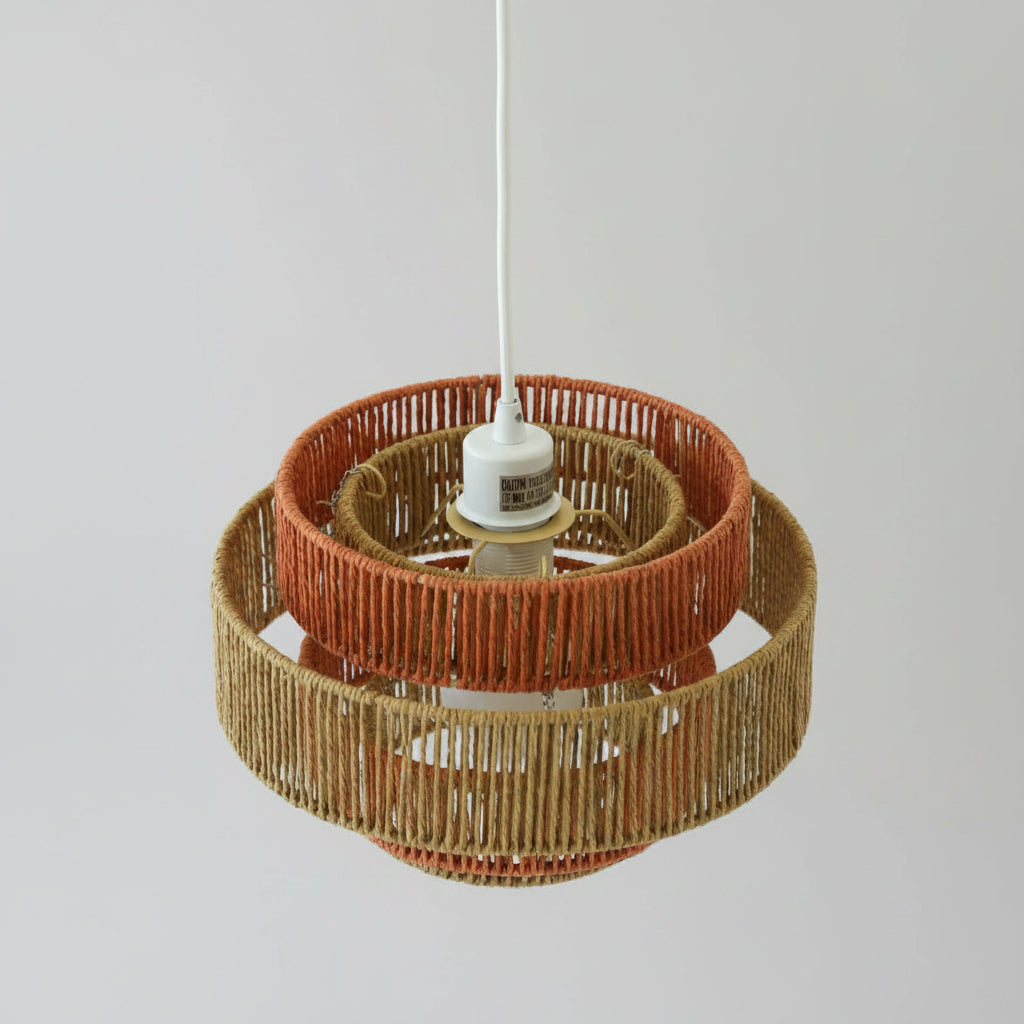 Woven lampshade with a white bulb on a white background