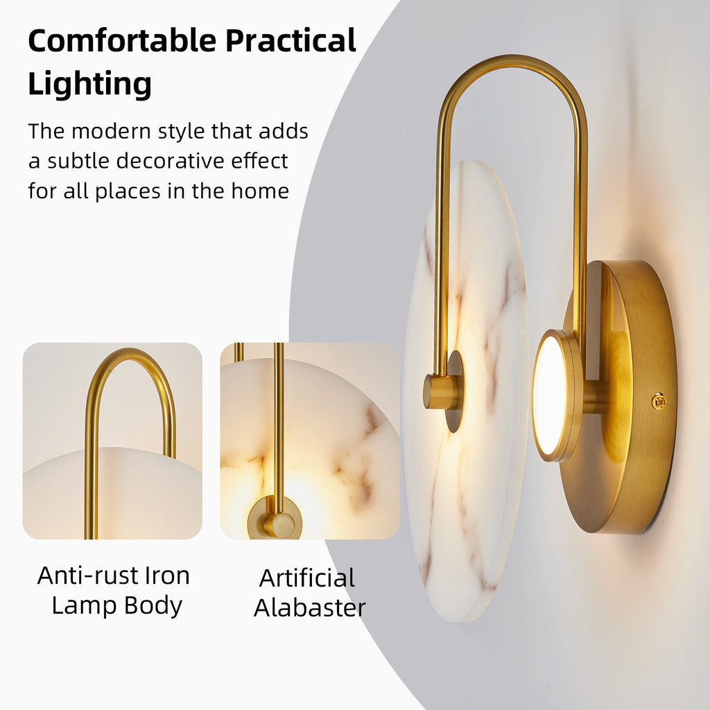 A modern wall-mounted light fixture with a curved gold-toned metal arm, a round illuminated light panel, and a white marble-look shade. The image includes marketing text and two inset close-ups highlighting the gold lamp body and artificial alabaster shade.