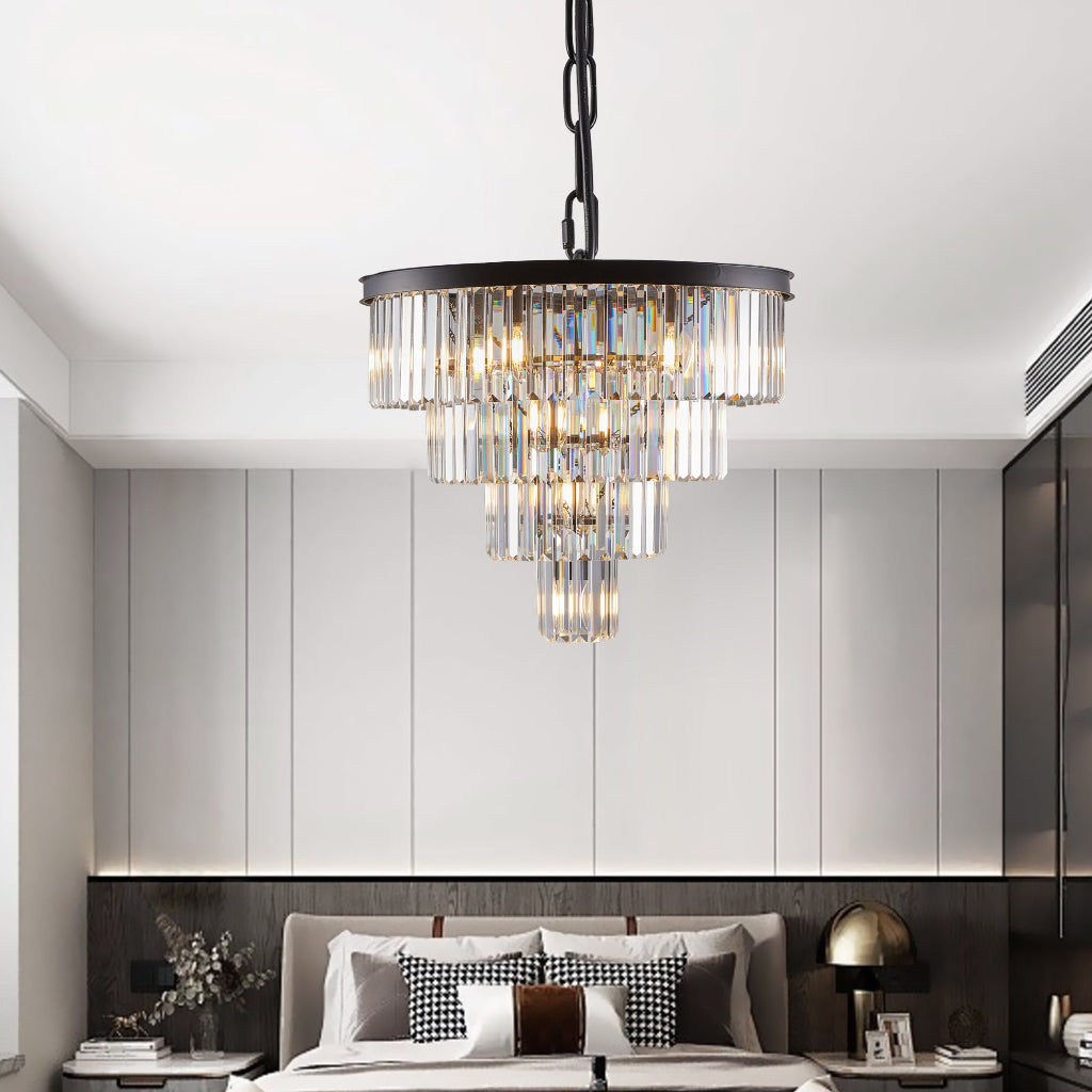 Chandelier hanging in a modern bedroom with neutral walls and decor.
